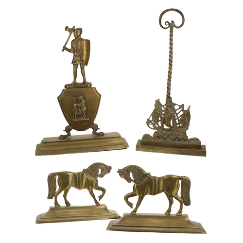 1013 - 19th century brass and iron doorstop modelled with a soldier in a suit of armour over a bear shield ... 