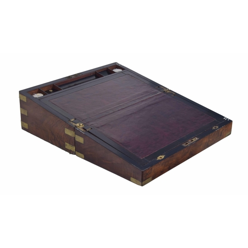 1272 - Victorian figured walnut brass bound writing slope, with a fitted interior and two glass inkwells, 1... 