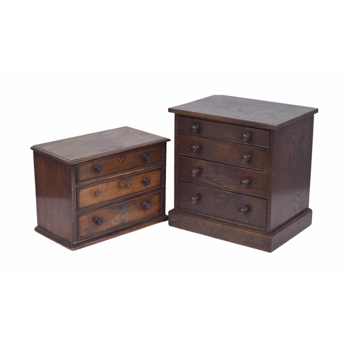 1085 - Miniature oak table-top collectors chest with four graduated drawers on a plinth base, 12” wide, dep... 