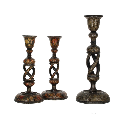 1107 - Pair of Kashmiri papier maché candlesticks, on open barley twist supports with floral decoration, 9.... 