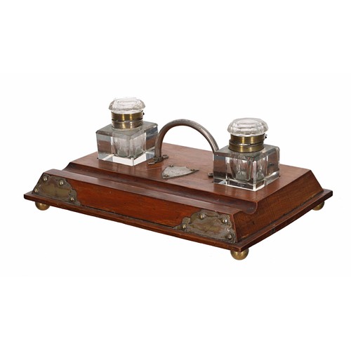 1008 - Early 20th century oak inkstand, with silver plated mounts, loop carry-handle and inset with a pair ... 