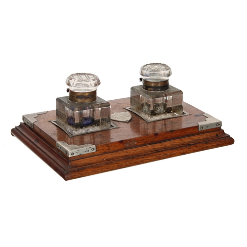 1061 - Edwardian oak rectangular inkstand with applied silver mounts, London 1904, inset with a pair of squ... 