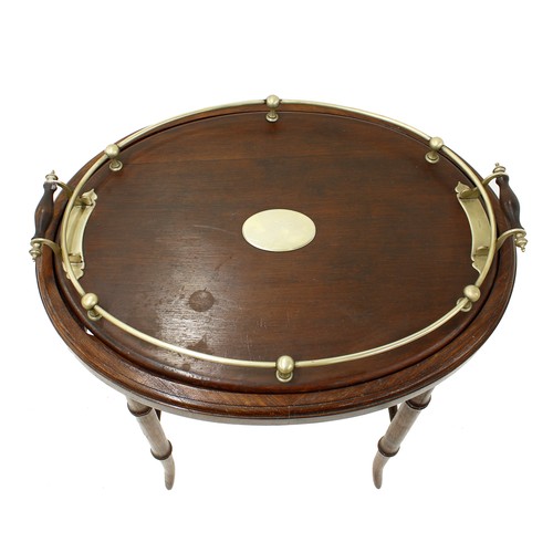 1262 - Oval oak twin-handled gallery tray with silver plated mounts upon an oak stand with faux bamboo supp... 