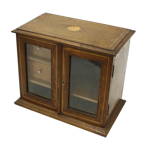 1065 - Early 20th century oak inlaid smokers cabinet, the top inset with a circular paterae and boxwood str... 