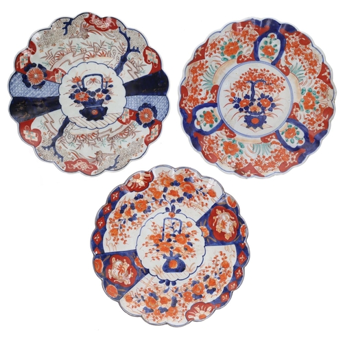 1569 - Three similar 19th century Japanese porcelain Imari chargers, each with foliate designs to the centr... 