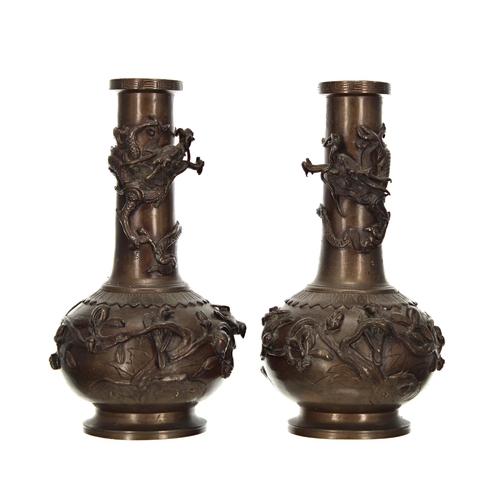 1581 - Pair of Japanese bronze bottle shape vases, applied with entwined dragons over the base with birds p... 