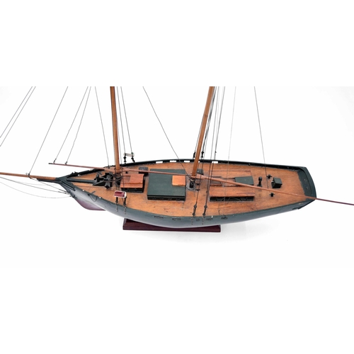 1237 - Good wooden scale model schooner, with two masts, rigging, half green painted hull with two cabins a... 