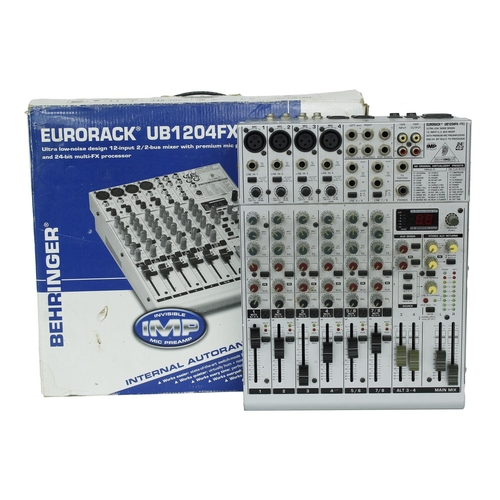 3053 - Pair of Behringer Eurolive B212D PA speakers, boxed; together with a Behringer Xenyx 1202 mixer and ... 