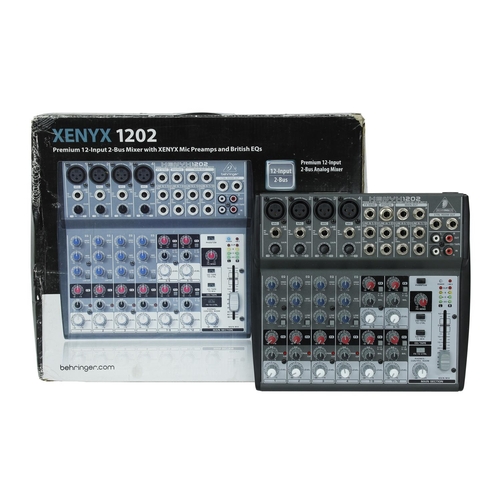 3053 - Pair of Behringer Eurolive B212D PA speakers, boxed; together with a Behringer Xenyx 1202 mixer and ... 