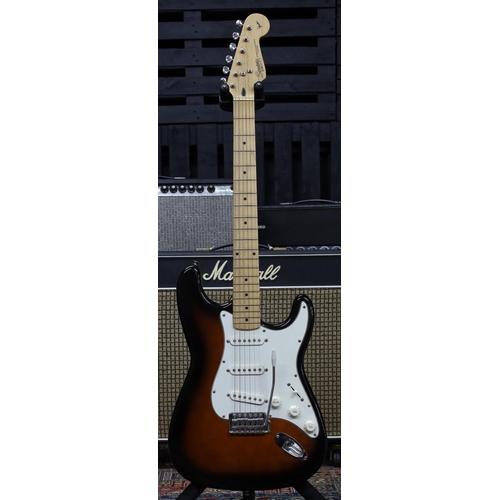 777 - 1997 Squier by Fender Stratocaster electric guitar, made in Korea; Body: two-tone sunburst finish, l... 