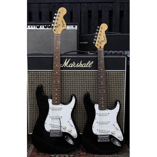 841 - 2002 Squier by Fender Strat electric guitar; together with a Squier by Fender Mini electric guitar (... 