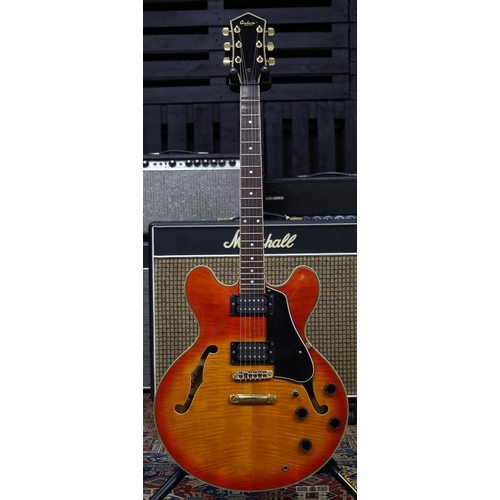 848 - 1980s Antoria Rockstar EG1935 semi-hollow body electric guitar, made in Korea; Body: amber burst fig... 