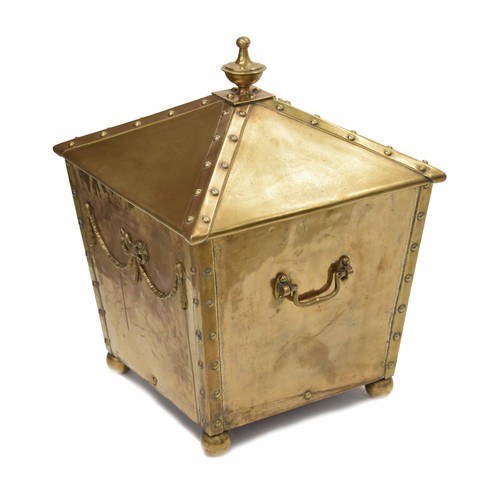 1030 - Neoclassical style polished brass square fireside bin, with urn finial over riveted decoration, side... 