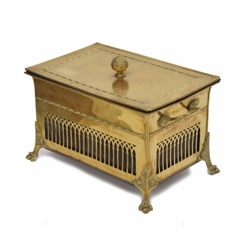 1094 - Decorative polished brass fireside box, with hinged cover and cast finial over fixed carry-handles a... 