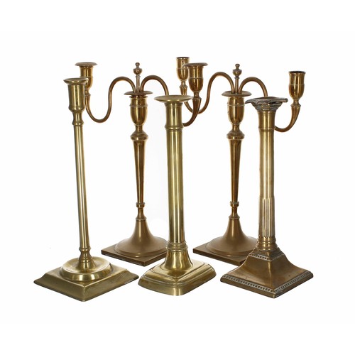 1097 - Pair of brass twin branch candelabra, with scroll branches upon square bases, 13.5” high (one candle... 