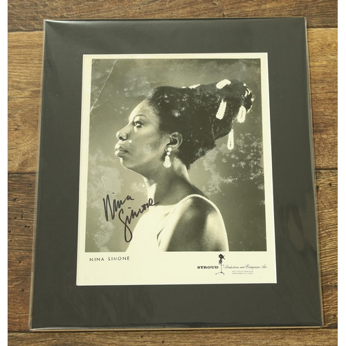 594 - Nina Simone - autographed black and white photograph, within mount, 13.5