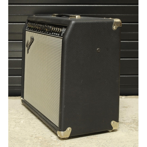 924 - Fender Deluxe 112 Plus guitar amplifier, made in USA, with footswitch; together with a Warwick Blue ... 