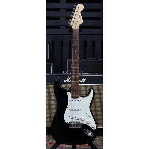 851 - Squier by Fender Strat electric guitar, black finish, with Marshall soft bag