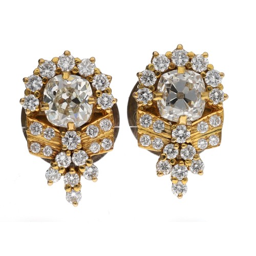 149 - Fine pair of old-cut diamond earrings with brilliant-cut surrounds in yellow gold, the centre stones... 