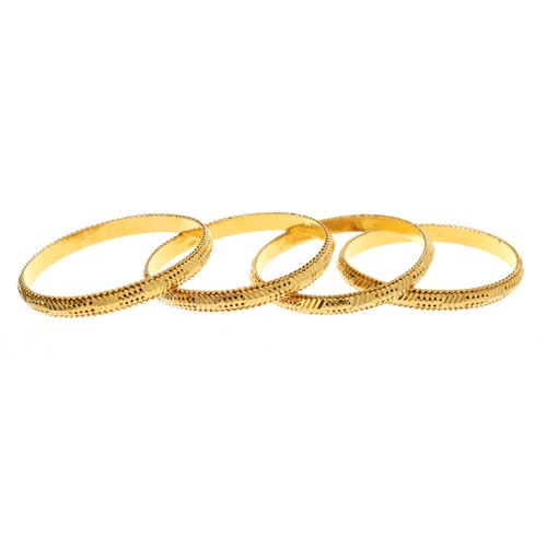 66 - Four high grade yellow metal bangles, marked '22C', 70.9gm in total (4)** slightly out of shape (ref... 