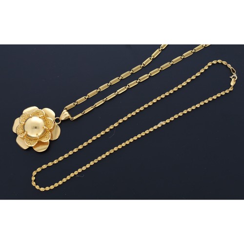 67 - Yellow metal flower pendant on necklace and a yellow metal necklet, marked '21K', 43.8gm (ref.26)... 