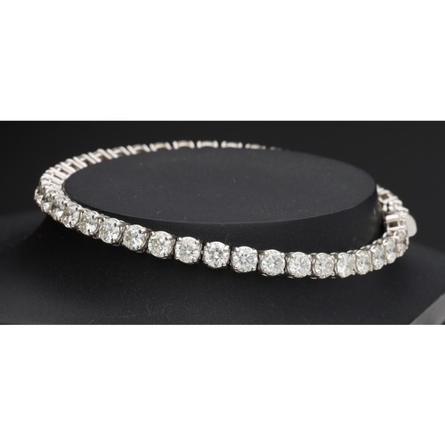 82 - Fine white gold diamond tennis bracelet, set with forty-two round brilliant-cuts, estimated 8.40ct a... 