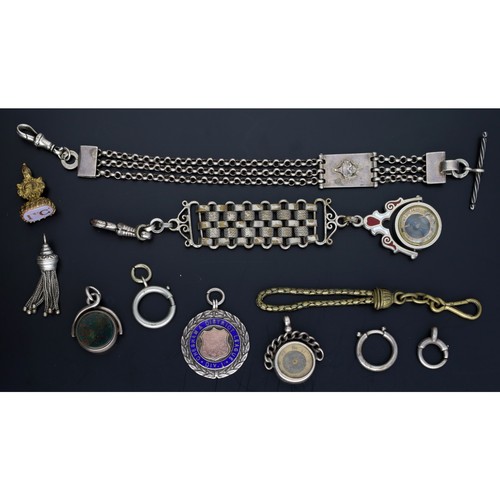 112 - White metal chatelaine with a compass fob (fob glass at fault); together with a white metal chatelai... 