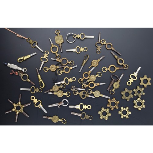 116 - Collection of pocket watch keys to include a spider key, seven spider key mounts and a trade key (45... 