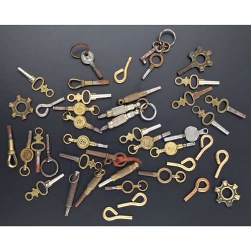 121 - Quantity of assorted pocket watch keys to include three spider key mounts (42)