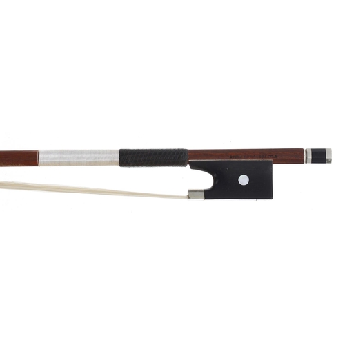 2232 - Silver mounted violin bow stamped Vtor Fetique á Paris, the stick round, the ebony frog inlaid with ... 