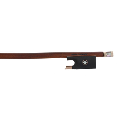 2251 - Gold mounted violin bow stamped Audinot á Paris, the stick round, the ebony frog inlaid with ... 