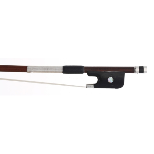 2254 - Silver mounted violoncello bow stamped N.V. de N.M. Adam, the stick round, the ebony frog inlaid wit... 