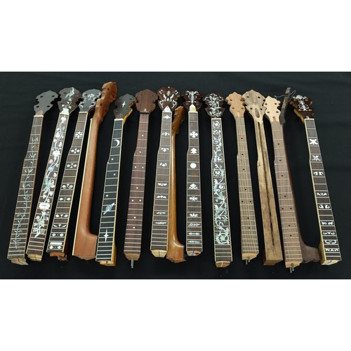 1514 - Fifteen various decorative and plain banjo necks, some unfinished and others in need of restoration ... 