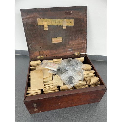 263 - Wooden hinged box containing a quantity of mainsprings