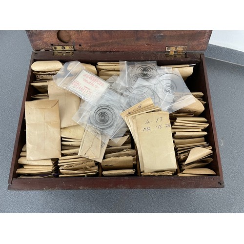 263 - Wooden hinged box containing a quantity of mainsprings