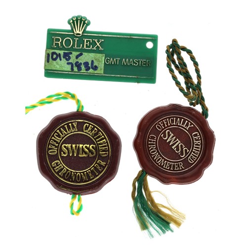 418 - Rolex GMT Master green tag; together with two Rolex red swing tags (3)