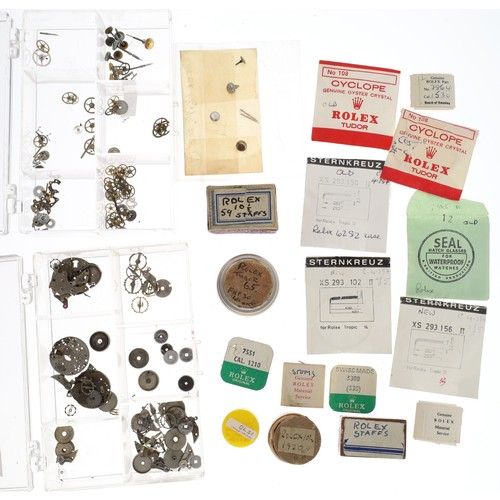 458 - Rolex - Quantity of Rolex and Tudor watch parts to include crystals, crowns, stems, staffs etc... 