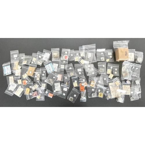 450 - Omega - Quantity of assorted Omega watch parts to include staffs, stems, mainsprings, balances, hand... 