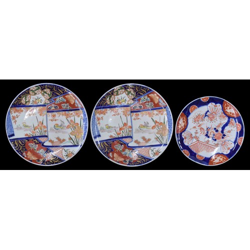 1584 - Pair of Japanese Imari porcelain chargers, polychrome decorated with scroll panels of birds, with fu... 