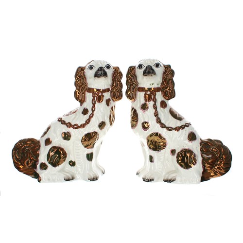 1561 - Pair of Victorian Staffordshire pottery spaniels, with copper lustre coats, 12.5” high; together wit... 