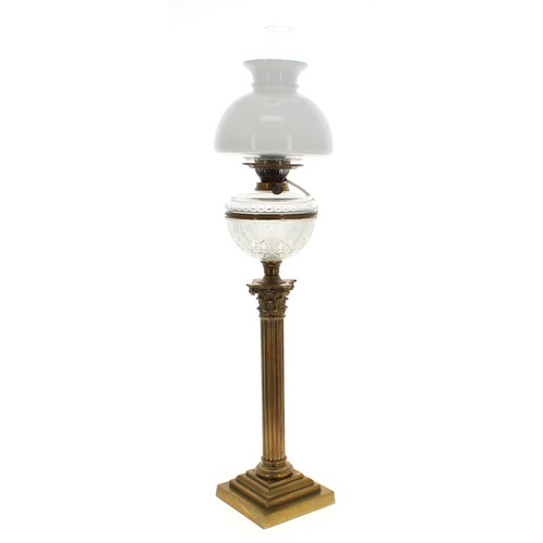 1189 - 19th century Corinthian column brass oil lamp, with a cut glass reservoir upon a brass support with ... 