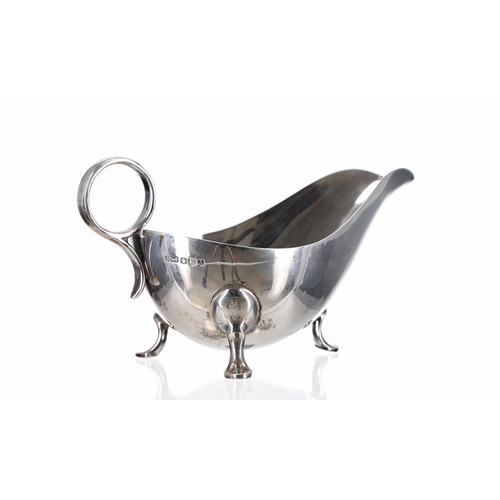 501 - James Dixon & Sons Ltd silver sauce boat, with ring handle and raised on three cast paw fee... 