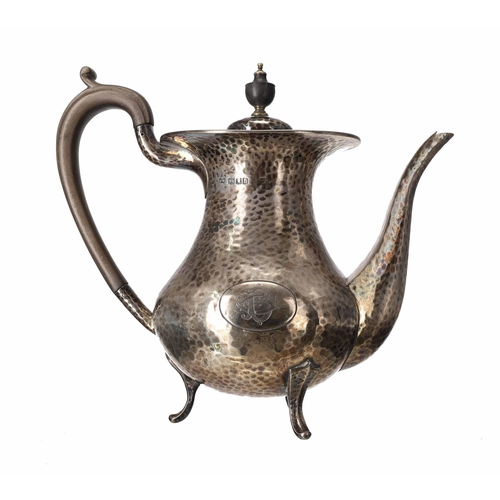 510 - George V planished silver coffee pot, the hinged cover with hardwood finial and with a hardwood scro... 