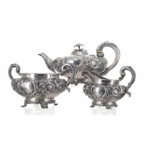 519 - Good Victorian three-piece silver tea set, comprising teapot, cream jug and sucrier, all with scroll... 