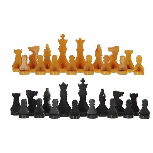 532 - Art Deco bakelite chess set in the manner of Silette, 32 pieces in amber and black bakelite, kings 7... 