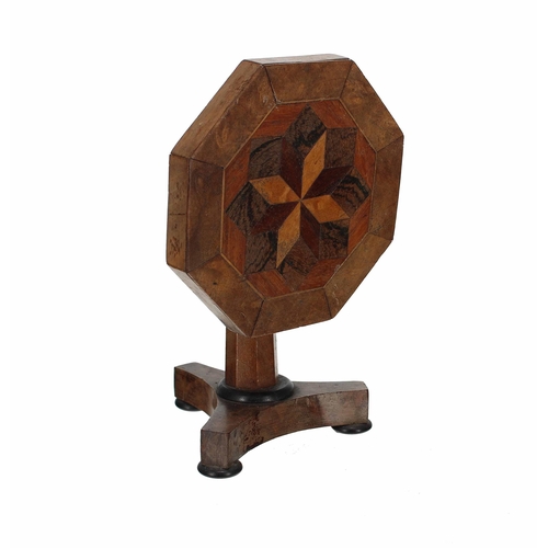 576 - Apprentice miniature tilt-top octagonal parquetry table, the decorated top on an octagonal central s... 