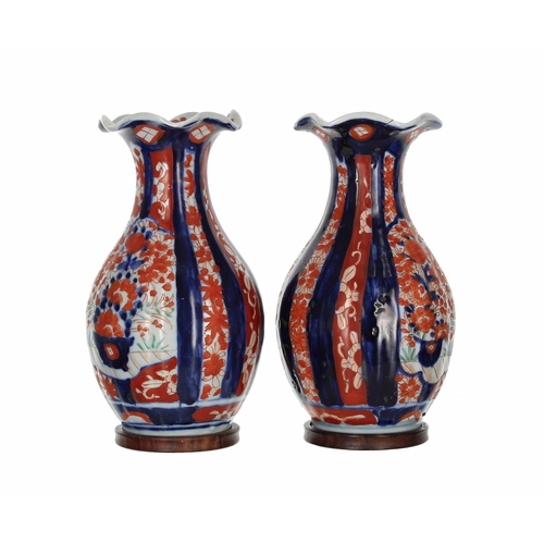 639 - Pair of 19th century Japanese Imari pottery vases, each with lobed moulded bodies and flared rims, d... 