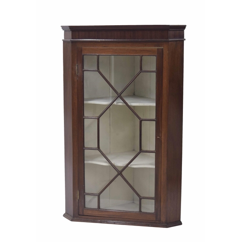 766 - Georgian mahogany hanging corner cabinet, the astragal glazed door enclosing a painted interior with... 