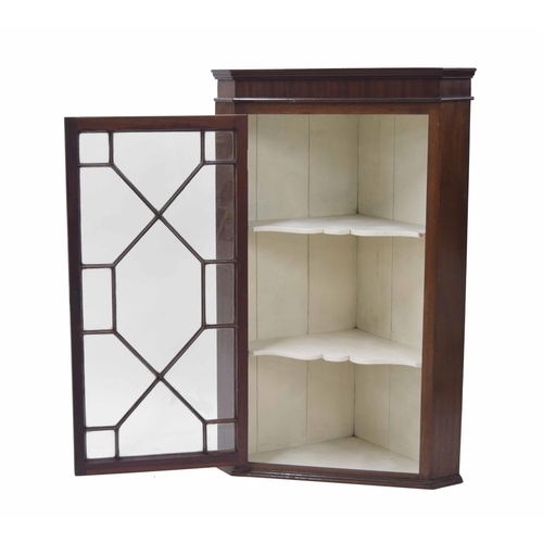 766 - Georgian mahogany hanging corner cabinet, the astragal glazed door enclosing a painted interior with... 