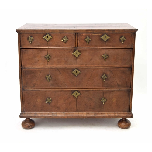 773 - Queen Anne walnut and feather banded chest of drawers, the split veneer top over two short and three... 